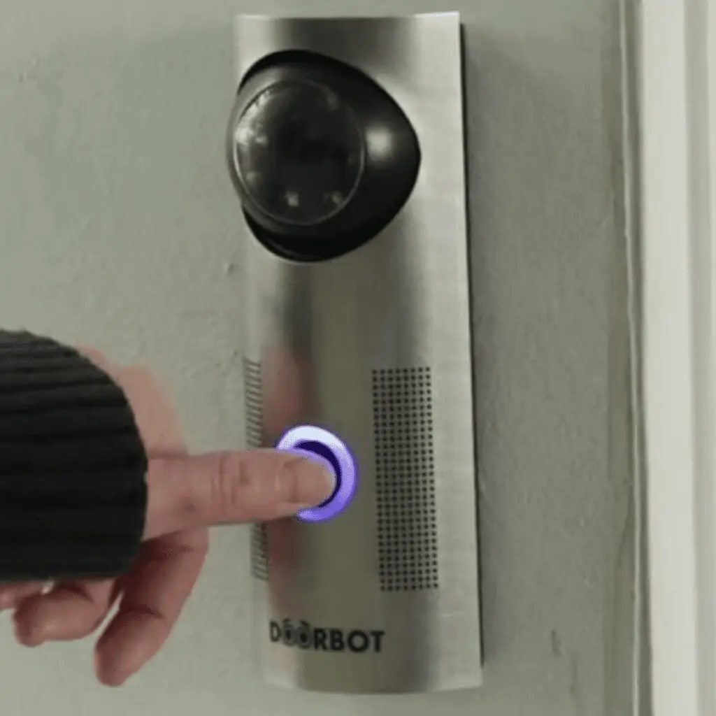 A visitor uses the smart doorbell Ring