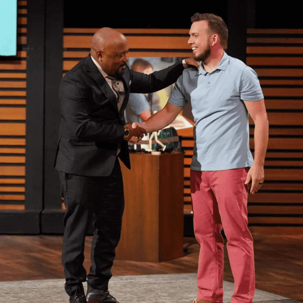 Daymond John and Les Cookson celebrate after agreeing their Shark Tank deal