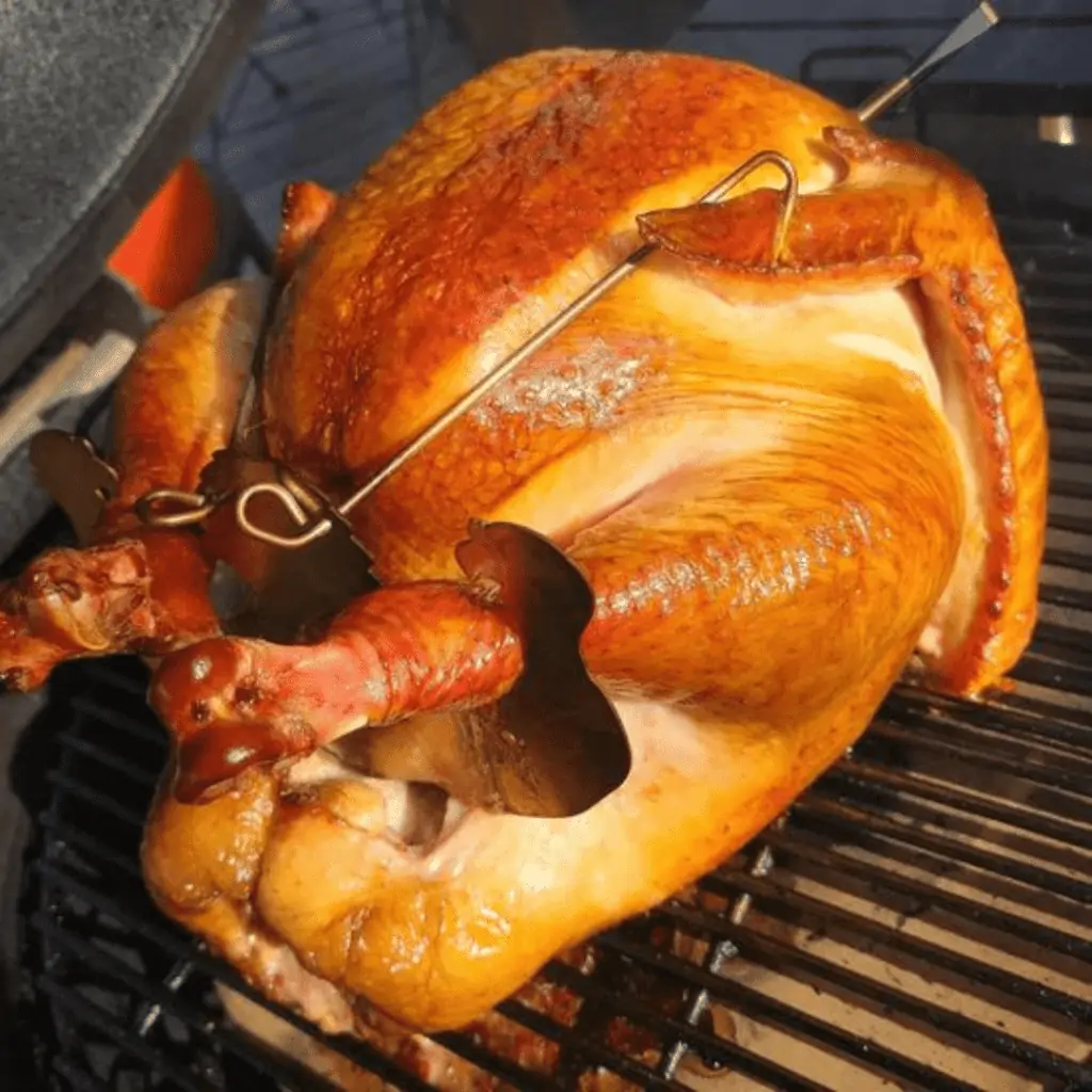 Turbo Trusser being used to cook a turkey on a grill