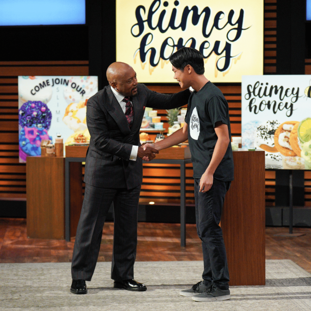 Daymond John and Mark Lin celebrate their Shark Tank deal